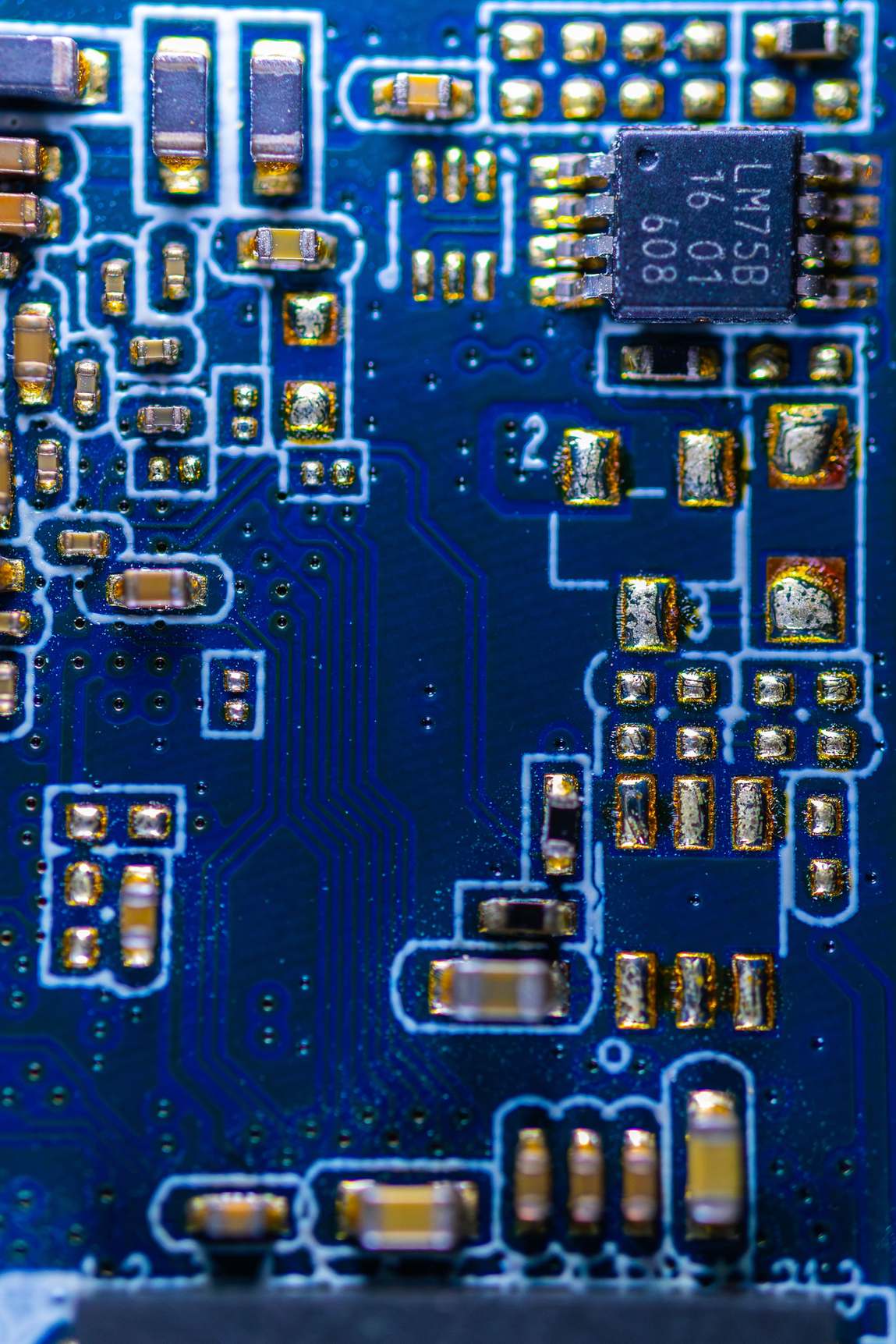 Close view of a printed circuit board surface with microchips